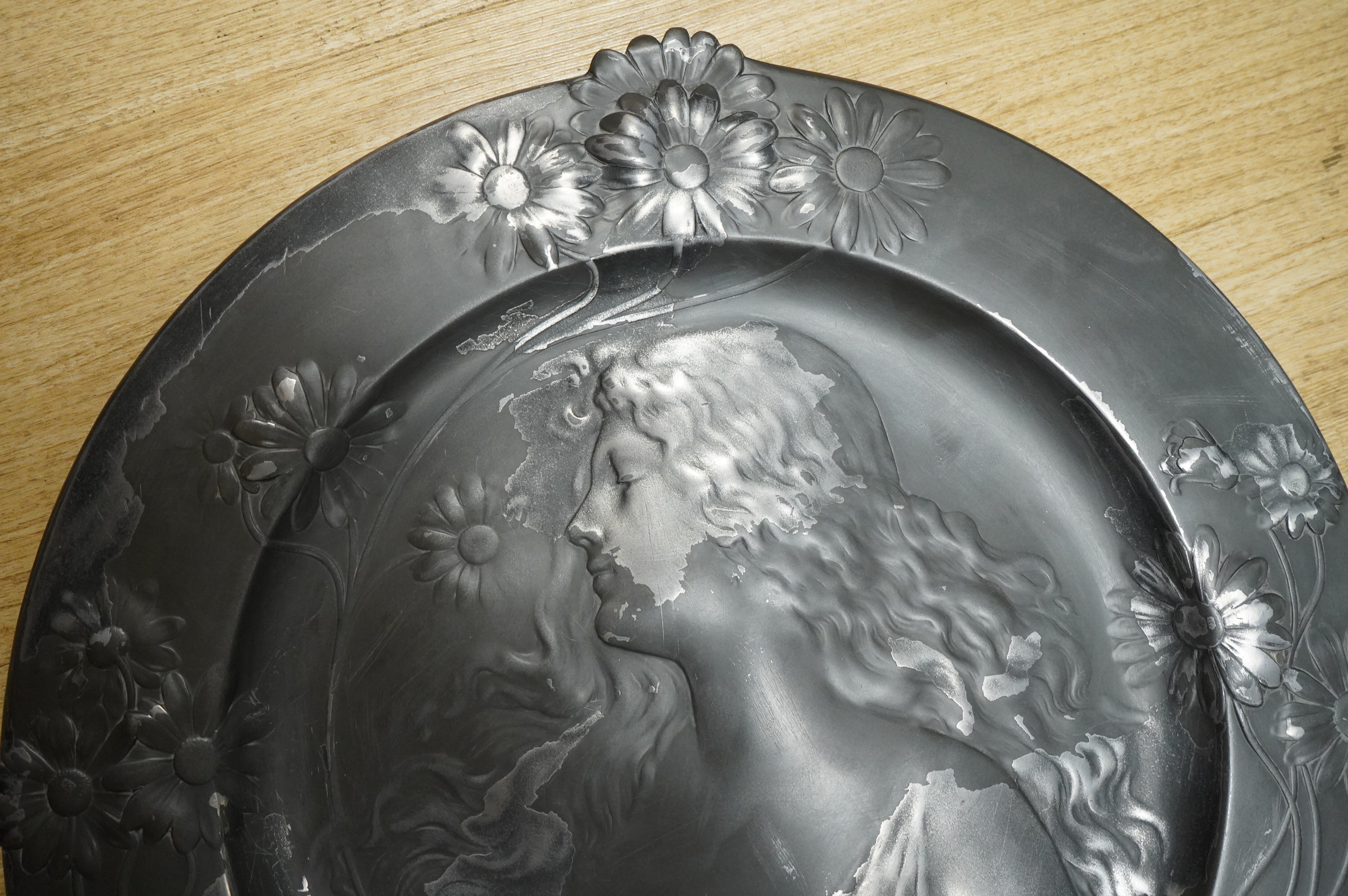 A circular Art Nouveau style figural wall charger, 50cm in diameter